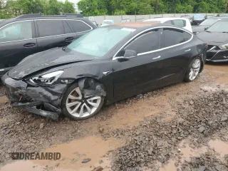 2018 Tesla Model 3 Long Range Battery z VIN 5YJ3E1EA1JF026390, wystawiony jako Copart lot #56954715 z przebiegiem Nie podano mil oraz Szkoda całkowita • Salvage title. Historia ofert i sprzedaży dostępna na DreamBid. Obrazek 1.