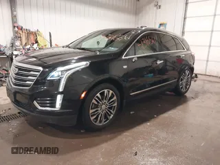 2019 Cadillac XT5 Premium Luxury AWD z VIN 1GYKNFRSXKZ189590, wystawiony jako IAAI lot #41316561 z przebiegiem 98 755 mil mil oraz . Historia ofert i sprzedaży dostępna na DreamBid. Obrazek 19.