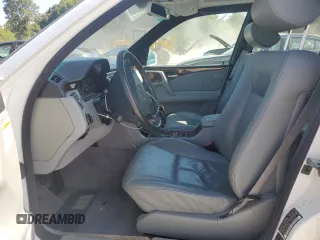 1999 Mercedes-Benz E-Class with VIN WDBJH65F1XA811693, listed as a Copart auction lot 69370604 with 128,876 mi miles and Salvage Title. Bid and sale history available at carsss.com. Image 7.