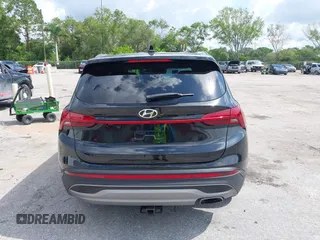 2021 Hyundai Santa Fe SE z VIN 5NMS14AJ0MH332918, wystawiony jako IAAI lot #42365534 z przebiegiem 58 720 mil mil oraz . Historia ofert i sprzedaży dostępna na DreamBid. Obrazek 16.