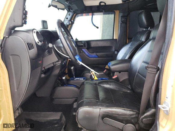 2012 Jeep Wrangler Unlimited Sahara with VIN 1C4BJWEG5CL281584, listed as a Copart auction lot 50982655 with 132,548 mi miles and Salvage Title. Bid and sale history available at carsss.com. Image 7.