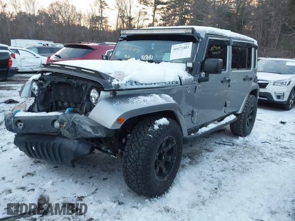 2015 Jeep Wrangler Unlimited Rubicon Hard Rock with VIN 1C4HJWFG1FL659803, listed as a IAAI auction lot 41172485 with 126,881 mi miles and . Bid and sale history available at DreamBid. Image 2.