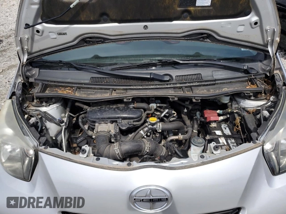 2012 Scion iQ with VIN JTNJJXB03CJ015321, listed as a Copart auction lot 54332355 with 63,439 mi miles and Salvage title. Bid and sale history available at DreamBid. Image 11.