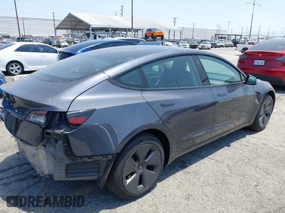 2023 Tesla Model 3 with VIN 5YJ3E1EA4PF400306, listed as a IAAI auction lot 42398603 with 18,551 mi miles and . Bid and sale history available at DreamBid. Image 4.
