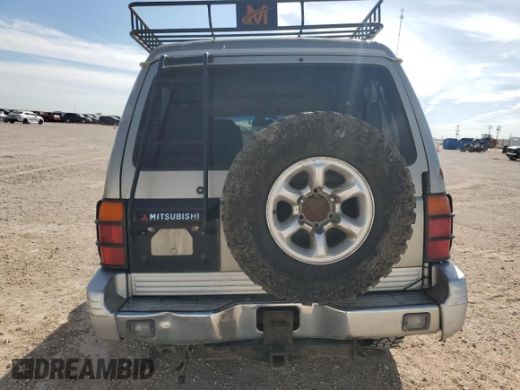 1998 Mitsubishi Montero z VIN JA4MR51R0WJ000921, wystawiony jako Copart lot #56250965 z przebiegiem 181 293 mil mil oraz Szkoda całkowita • Salvage title. Historia ofert i sprzedaży dostępna na DreamBid. Obrazek 6.