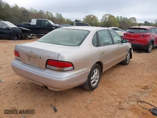 1997 Toyota Avalon XL with VIN 4T1BF12B1VU202935, listed as a IAAI auction lot 41900467 with 274,960 mi miles. Bid and sale history available at carsss.com. Image 4.