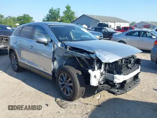 2021 Mazda CX-9 Touring z VIN JM3TCBCY4M0521429, wystawiony jako IAAI lot #42644494 z przebiegiem 72 870 mil mil oraz . Historia ofert i sprzedaży dostępna na DreamBid. Obrazek 1.