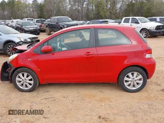 2009 Toyota Yaris with VIN JTDJT903595243068, listed as a IAAI auction lot 41899358 with 310,199 mi miles. Bid and sale history available at carsss.com. Image 14.