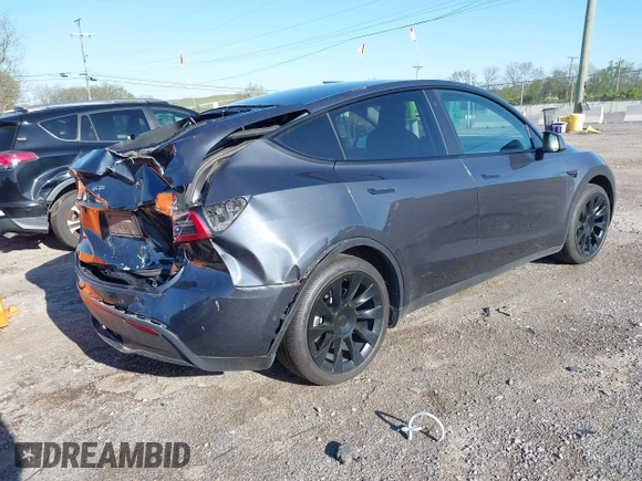 2021 Tesla Model Y Long Range with VIN 5YJYGAEE1MF149887, listed as a IAAI auction lot 42032104 with 54,932 mi miles. Bid and sale history available at carsss.com. Image 4.
