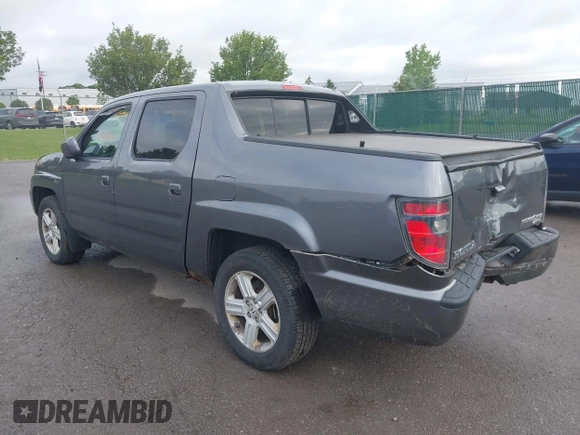 2014 Honda Ridgeline RTL with VIN 5FPYK1F5XEB011772, listed as a IAAI auction lot 42440390 with 145,219 mi miles and . Bid and sale history available at DreamBid. Image 3.