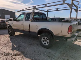 1999 Ford F-150 XL with VIN 1FTRX18L2XKA01348, listed as a Copart auction lot 50087595 with 202,021 mi miles and Salvage Title. Bid and sale history available at carsss.com. Image 2.
