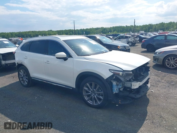 2021 Mazda CX-9 Grand Touring with VIN JM3TCBDY2M0541290, listed as a IAAI auction lot 42216643 with 38,661 mi miles and . Bid and sale history available at DreamBid. Image 1.