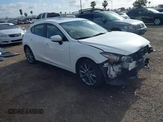 2018 Mazda 3 Touring with VIN 3MZBN1L31JM225108, listed as a IAAI auction lot 41959304 with 74,933 mi miles. Bid and sale history available at carsss.com. Image 1.