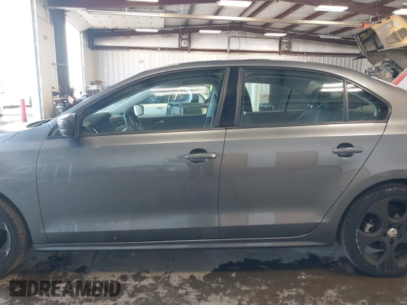 2014 Volkswagen Jetta Sedan S with VIN 3VW2K7AJ5EM410491, listed as a IAAI auction lot 42083614 with 65,960 mi miles. Bid and sale history available at carsss.com. Image 15.