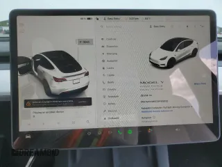 2023 Tesla Model Y Long Range z VIN 7SAYGDEE3PF916132, wystawiony jako Copart lot #51645625 z przebiegiem 28 238 mil mil oraz Szkoda całkowita • Salvage title. Historia ofert i sprzedaży dostępna na DreamBid. Obrazek 9.