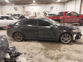 2020 Ford Fusion Hybrid Titanium with VIN 3FA6P0RU8LR141355, listed as a IAAI auction lot 41417807 with 61,288 mi miles. Bid and sale history available at carsss.com. Image 13.