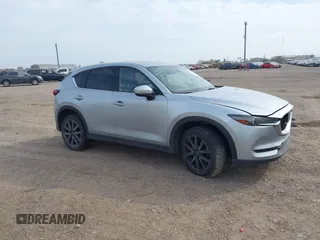 2017 Mazda CX-5 Grand Touring with VIN JM3KFBDL8H0227348, listed as a IAAI auction lot 41572377 with 124,908 mi miles. Bid and sale history available at carsss.com. Image 1.
