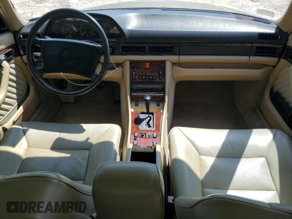 1991 Mercedes-Benz 560 with VIN WDBCA39E9MA599487, listed as a Copart auction lot 51921915 with 59,132 mi miles and Salvage Title. Bid and sale history available at DreamBid. Image 8.
