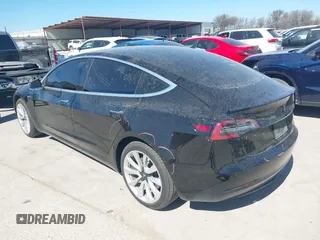 2020 Tesla Model 3 Standard Range Plus with VIN 5YJ3E1EAXLF614002, listed as a IAAI auction lot 41758898 with 42,363 mi miles and . Bid and sale history available at DreamBid. Image 3.