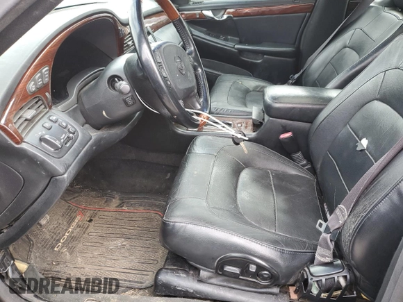 2004 Cadillac DeVille DTS z VIN 1G6KF57944U253624, wystawiony jako Copart lot #49444905 z przebiegiem 174 823 mil mil oraz Szkoda całkowita • Salvage title. Historia ofert i sprzedaży dostępna na DreamBid. Obrazek 7.