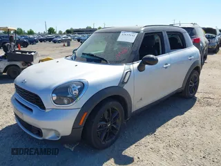 2014 MINI Countryman S with VIN WMWZC5C54EWP40882, listed as a IAAI auction lot 42633141 with 176,641 mi miles and . Bid and sale history available at DreamBid. Image 2.
