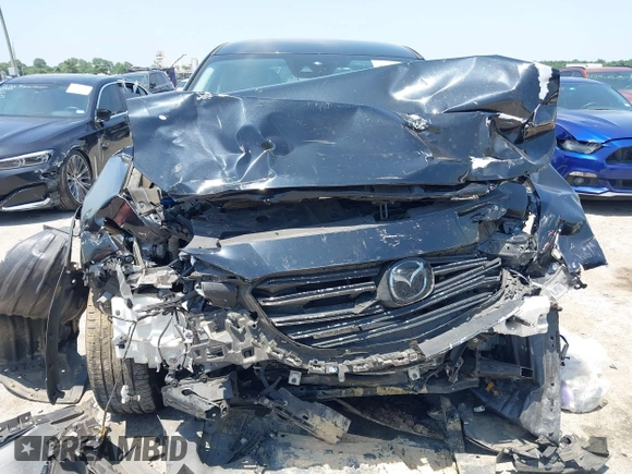 2021 Mazda CX-9 Touring with VIN JM3TCBCY8M0514905, listed as a IAAI auction lot 42385627 with 72,610 mi miles and . Bid and sale history available at DreamBid. Image 6.