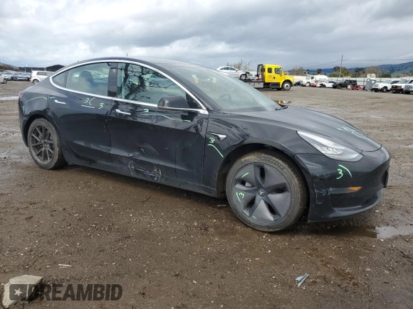 2019 Tesla Model 3 Long Range with VIN 5YJ3E1EB8KF384533, listed as a Copart auction lot 48557255 with 73,768 mi miles and Salvage Title. Bid and sale history available at carsss.com. Image 4.