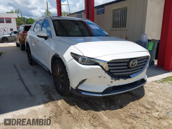 2016 Mazda CX-9 Grand Touring with VIN JM3TCADYXG0113563, listed as a IAAI auction lot 42593120 with 237,696 mi miles and . Bid and sale history available at DreamBid. Image 1.