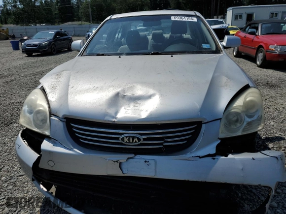 2008 Kia Optima LX z VIN KNAGE123185190108, wystawiony jako Copart lot #59364195 z przebiegiem 131 344 mil mil oraz Szkoda całkowita • Salvage title. Historia ofert i sprzedaży dostępna na DreamBid. Obrazek 5.