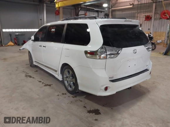 2014 Toyota Sienna SE with VIN 5TDXK3DC7ES497390, listed as a IAAI auction lot 42037096 with 169,127 mi miles and . Bid and sale history available at DreamBid. Image 3.