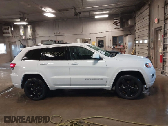 2015 Jeep Grand Cherokee Laredo with VIN 1C4RJFAG4FC660665, listed as a IAAI auction lot 41529532 with 124,099 mi miles. Bid and sale history available at carsss.com. Image 13.