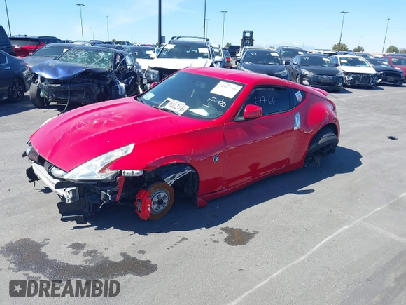 2014 Nissan 370Z Nismo with VIN JN1AZ4EH9EM636306, listed as a IAAI auction lot 41467766 with 101,021 mi miles and . Bid and sale history available at DreamBid. Image 2.