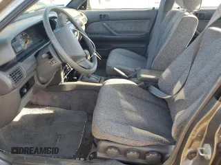 1989 Toyota Camry z VIN JT2SV21E8K0314703, wystawiony jako Copart lot #76053194 z przebiegiem 124 873 mil mil oraz Nie do naprawy • Non repairable. Historia ofert i sprzedaży dostępna na DreamBid. Obrazek 7.
