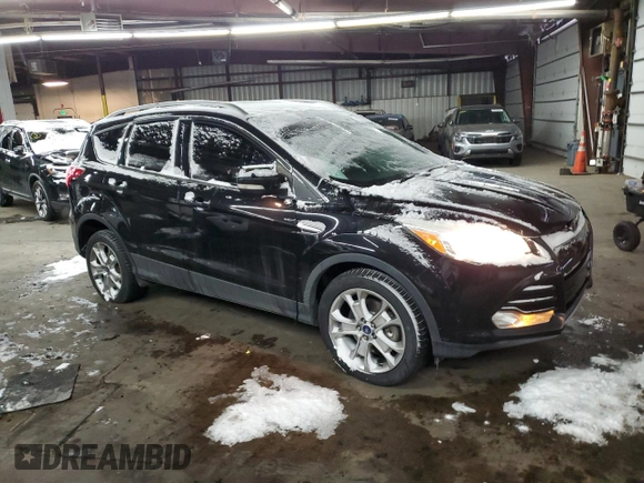 2015 Ford Escape Titanium with VIN 1FMCU0J91FUA41653, listed as a Copart auction lot 88871205 with 128,971 mi miles and Salvage Title. Bid and sale history available at DreamBid. Image 4.