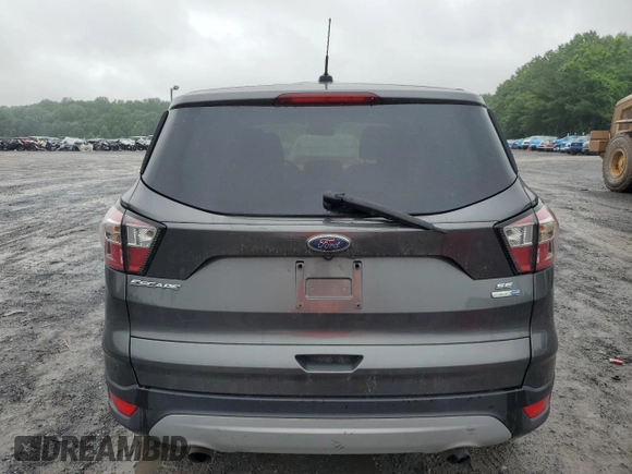2017 Ford Escape SE z VIN 1FMCU9GD4HUE68604, wystawiony jako Copart lot #61170775 z przebiegiem 152 286 mil mil oraz Czysty tytuł • Clean title. Historia ofert i sprzedaży dostępna na DreamBid. Obrazek 6.