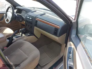1999 Jeep Grand Cherokee Laredo with VIN 1J4GW58S6XC554582, listed as a IAAI auction lot 41780284 with 183,156 mi miles. Bid and sale history available at carsss.com. Image 5.