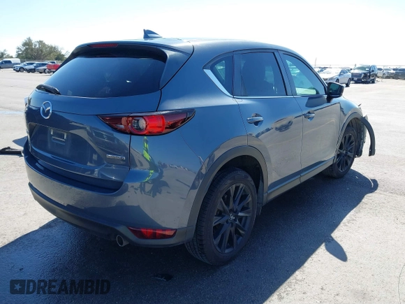 2021 Mazda CX-5 Touring with VIN JM3KFACM1M0317763, listed as a IAAI auction lot 41775712 with 75,068 mi miles. Bid and sale history available at carsss.com. Image 4.