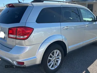 2013 Dodge Journey SXT with VIN 3C4PDDBG4DT593312, listed as a Copart auction lot 56431775 with 131,651 mi miles and Clean Title. Bid and sale history available at DreamBid. Image 4.