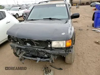 1999 Isuzu Rodeo S with VIN 4S2CM58W4X4339262, listed as a Copart auction lot 82804154 with 177,097 mi miles and Salvage Title. Bid and sale history available at carsss.com. Image 12.