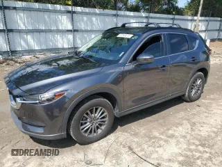 2017 Mazda CX-5 Touring z VIN JM3KFBCL4H0198870, wystawiony jako Copart lot #57263615 z przebiegiem 99 664 mil mil oraz Szkody całkowita. Historia ofert i sprzedaży dostępna na DreamBid. Obrazek 1.