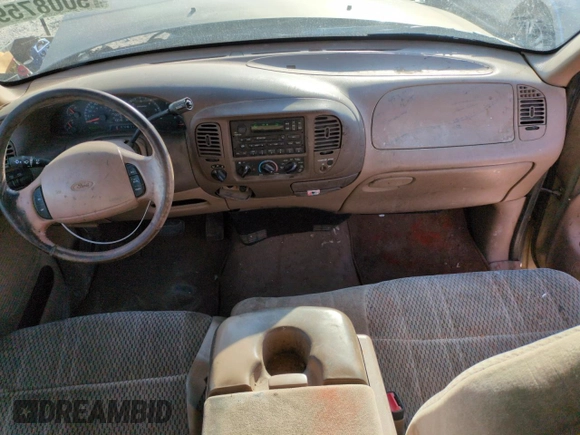 1999 Ford F-150 XL with VIN 1FTRX18L2XKA01348, listed as a Copart auction lot 50087595 with 202,021 mi miles and Salvage Title. Bid and sale history available at carsss.com. Image 8.