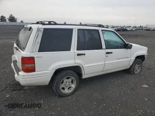 1998 Jeep Grand Cherokee Laredo with VIN 1J4GZ48S1WC165851, listed as a Copart auction lot 84110044 with 306,484 mi miles and Salvage Title. Bid and sale history available at carsss.com. Image 3.