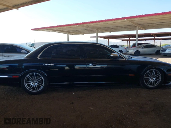 2005 Jaguar XJ Vanden Plas z VIN SAJWA82C05SG47589, wystawiony jako IAAI lot #42409697 z przebiegiem 222 598 mil mil oraz . Historia ofert i sprzedaży dostępna na DreamBid. Obrazek 13.