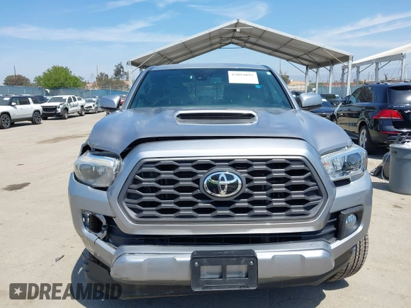 2021 Toyota Tacoma SR with VIN 3TMCZ5AN6MM393306, listed as a IAAI auction lot 42094095 with 57,217 mi miles and . Bid and sale history available at DreamBid. Image 12.