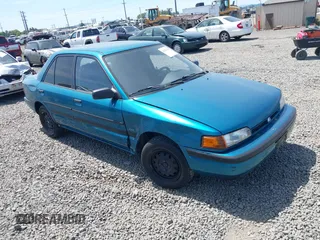 1994 Mazda Protege z VIN JM1BG224XR0709466, wystawiony jako IAAI lot #42413420 z przebiegiem 65 828 mil mil oraz . Historia ofert i sprzedaży dostępna na DreamBid. Obrazek 1.