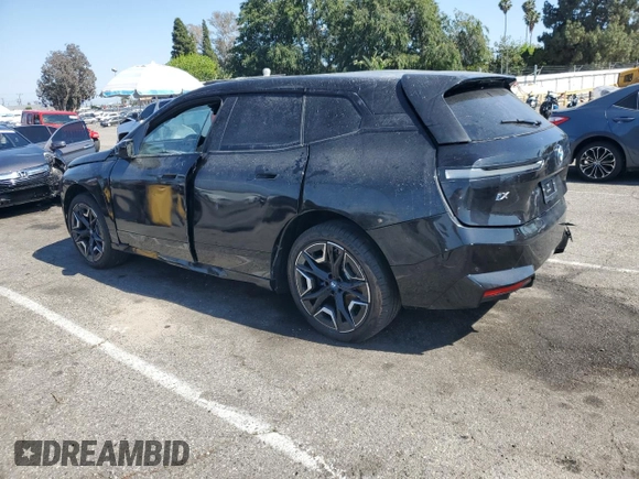 2025 BMW iX xDrive50 z VIN WB523CF02SCS06555, wystawiony jako Copart lot #55291115 z przebiegiem Nie podano mil oraz Szkoda całkowita • Salvage title. Historia ofert i sprzedaży dostępna na DreamBid. Obrazek 2.
