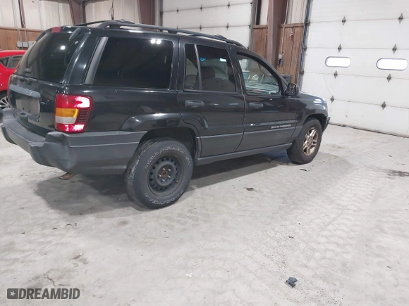 2003 Jeep Grand Cherokee Laredo with VIN 1J4GW48S63C552366, listed as a IAAI auction lot 41861501 with 227,464 mi miles. Bid and sale history available at carsss.com. Image 4.