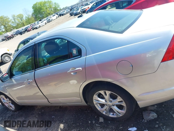 2012 Ford Fusion SE with VIN 3FAHP0HA6CR321255, listed as a IAAI auction lot 41971706 with 114,977 mi miles and . Bid and sale history available at DreamBid. Image 14.