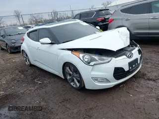 2014 Hyundai Veloster RE:FLEX z VIN KMHTC6AD7EU201432, wystawiony jako IAAI lot #41679369 z przebiegiem 90 454 mil mil oraz . Historia ofert i sprzedaży dostępna na DreamBid. Obrazek 1.