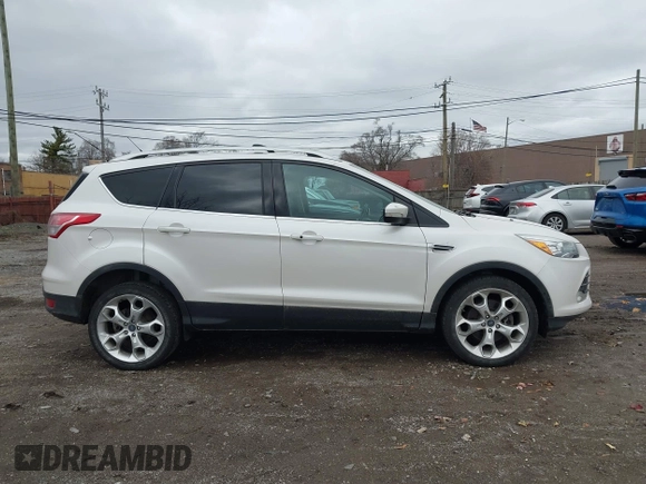 2013 Ford Escape Titanium with VIN 1FMCU0J96DUD85315, listed as a IAAI auction lot 41934204 with 152,132 mi miles and . Bid and sale history available at carsss.com. Image 13.